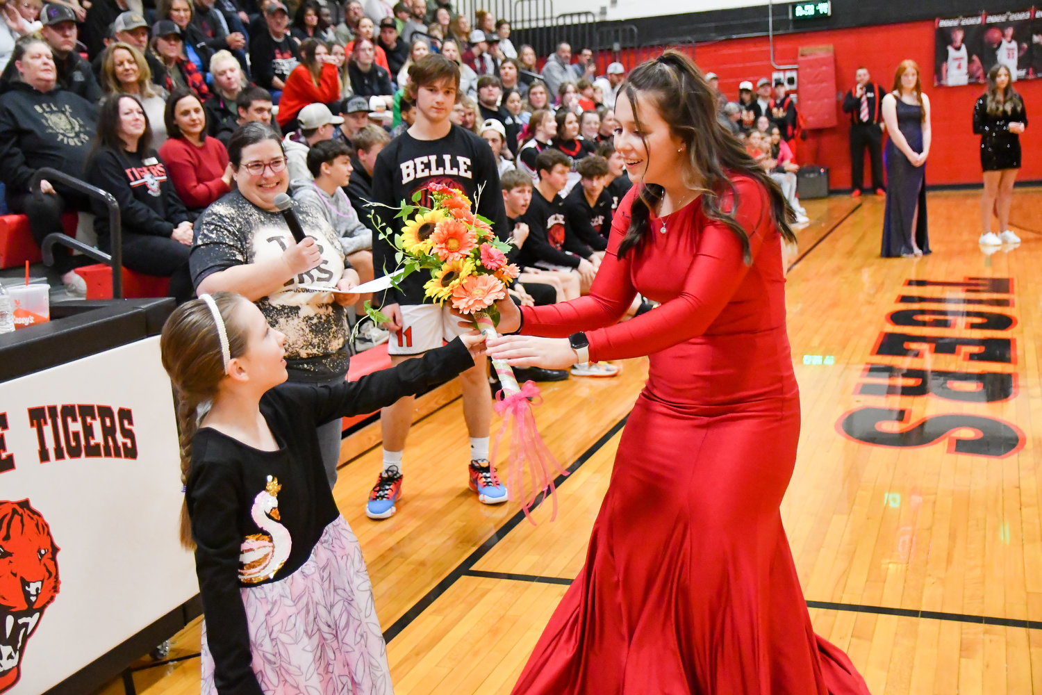 Homecoming Queen Ryleigh Long accepts flowers after being announced queen.