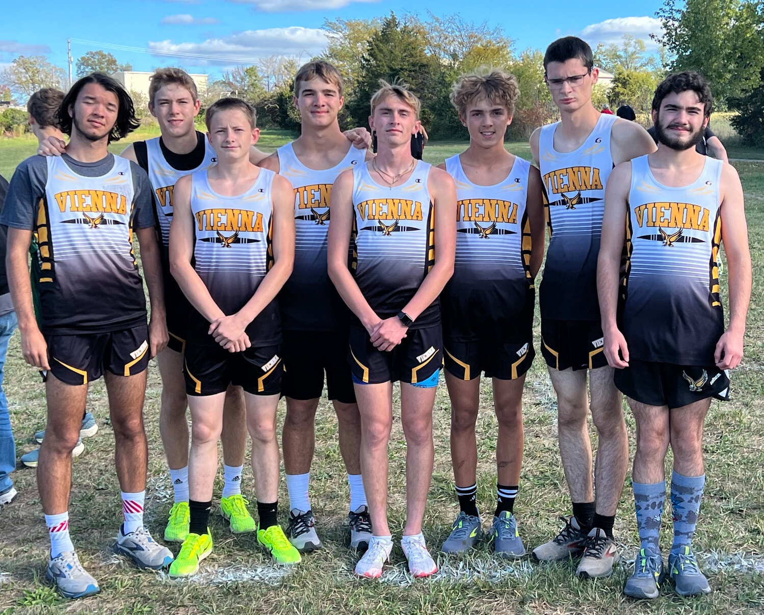 VIENNA EAGLE cross country team members (above) won two teams title over a seven-day span at Dixon last Monday and on their home course Monday night.