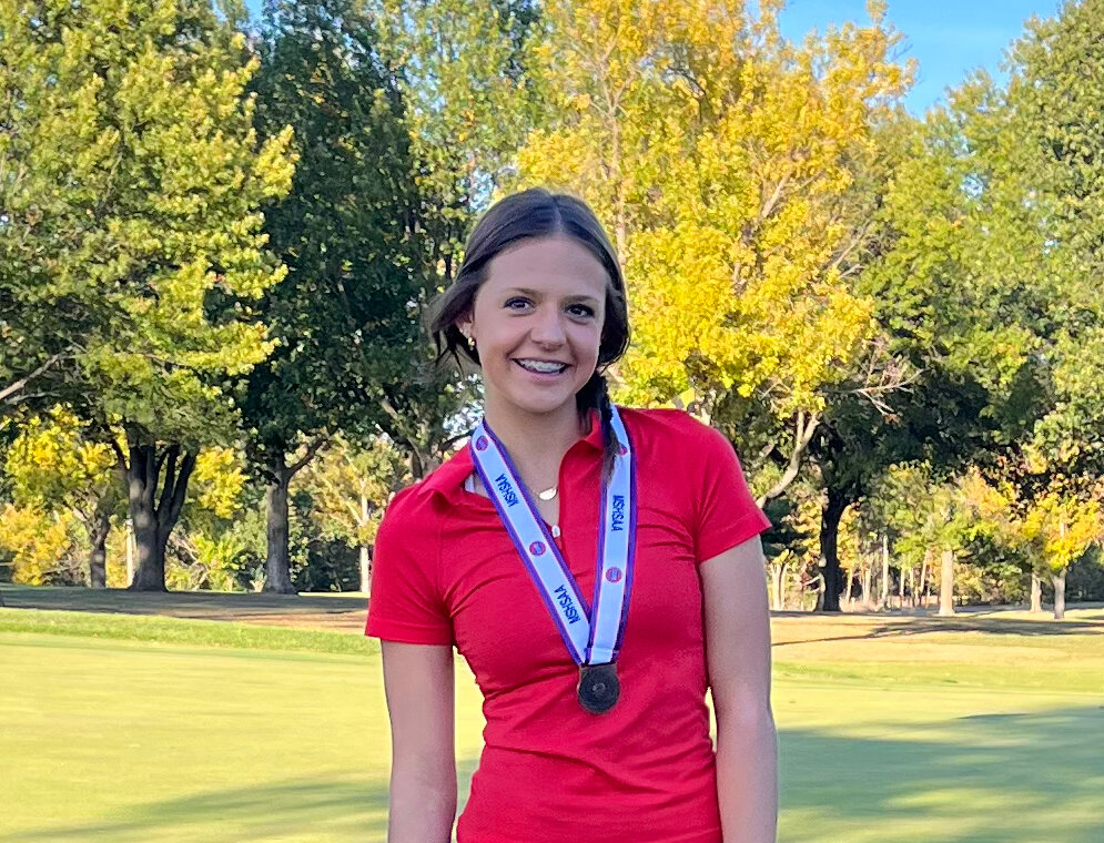 Anastyn Lansford proudly stands with her ninth-place medal following last Tuesday’s final round of the Missouri State High School Activities Association (MSHSAA) Class 1 Girls Golf Tournament.
